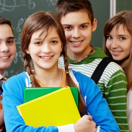 Portrait of happy teens looking at camera with smiles